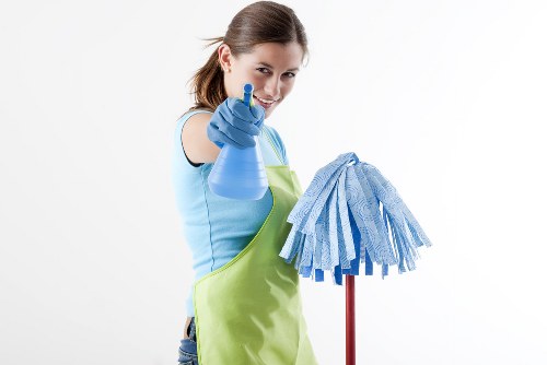 Post-construction cleaning of a renovated room with dust removal