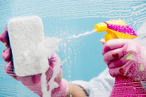 Deep cleaning a modern kitchen during house cleaning service