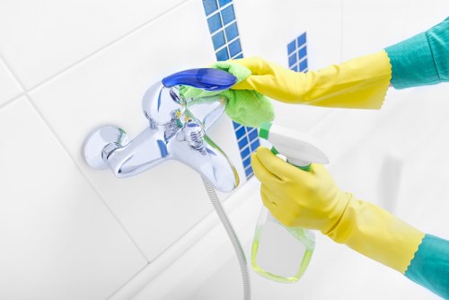 Close-up of tools used for window cleaning including squeegee and microfiber cloth