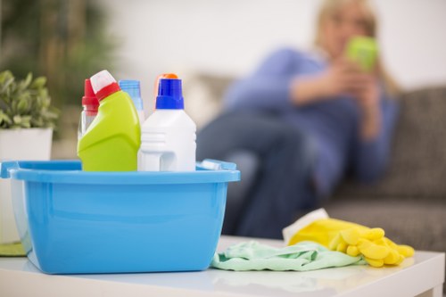 Commercial cleaning team sanitizing workspaces and surfaces