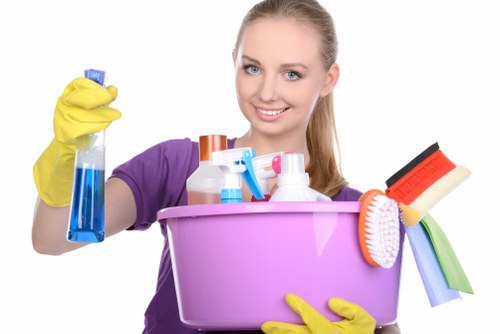 Professional cleaner maintaining a shared corridor in a building