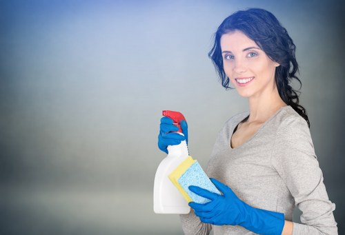 Vacuuming a sectional sofa during upholstery cleaning